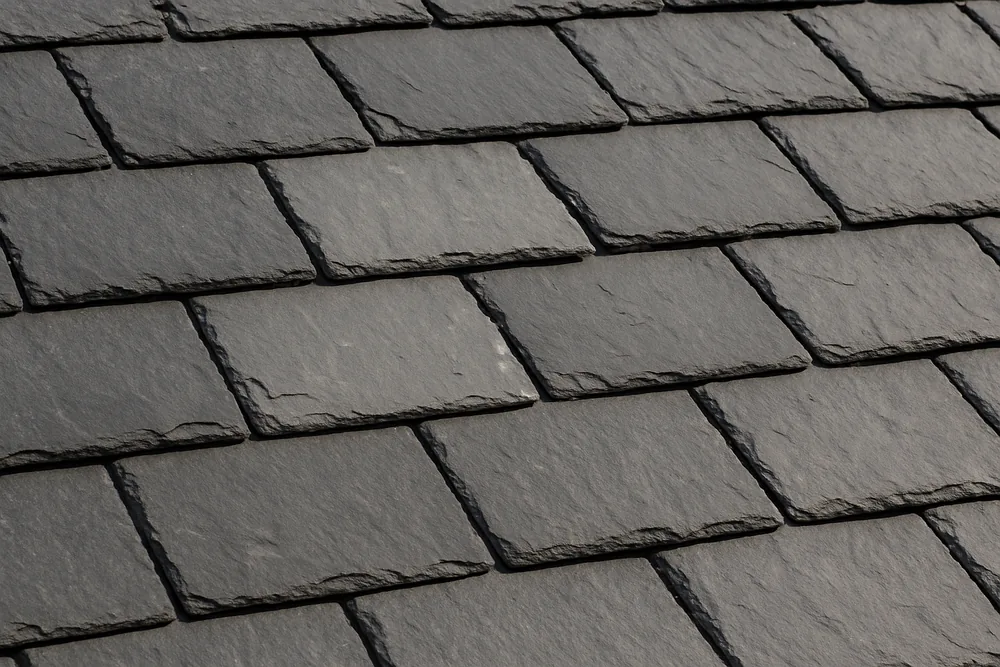 Overlapping grey slates in straight courses, one a shade lighter — slate roofing, Ballarat. Illustrative example.